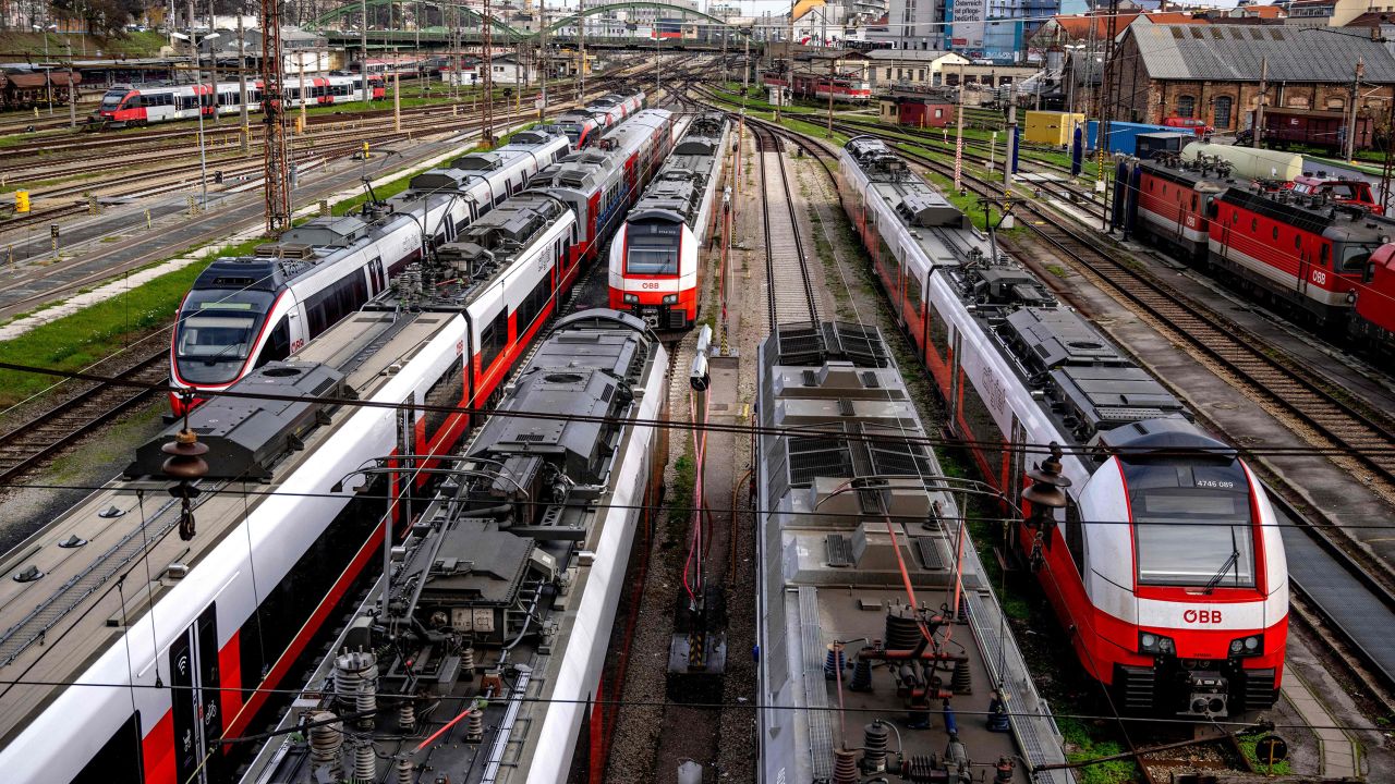 Trains of Austrian railway operator OeBB stand on the tracks at the Westbahnhof railway station in Vienna on November 28, 2022.