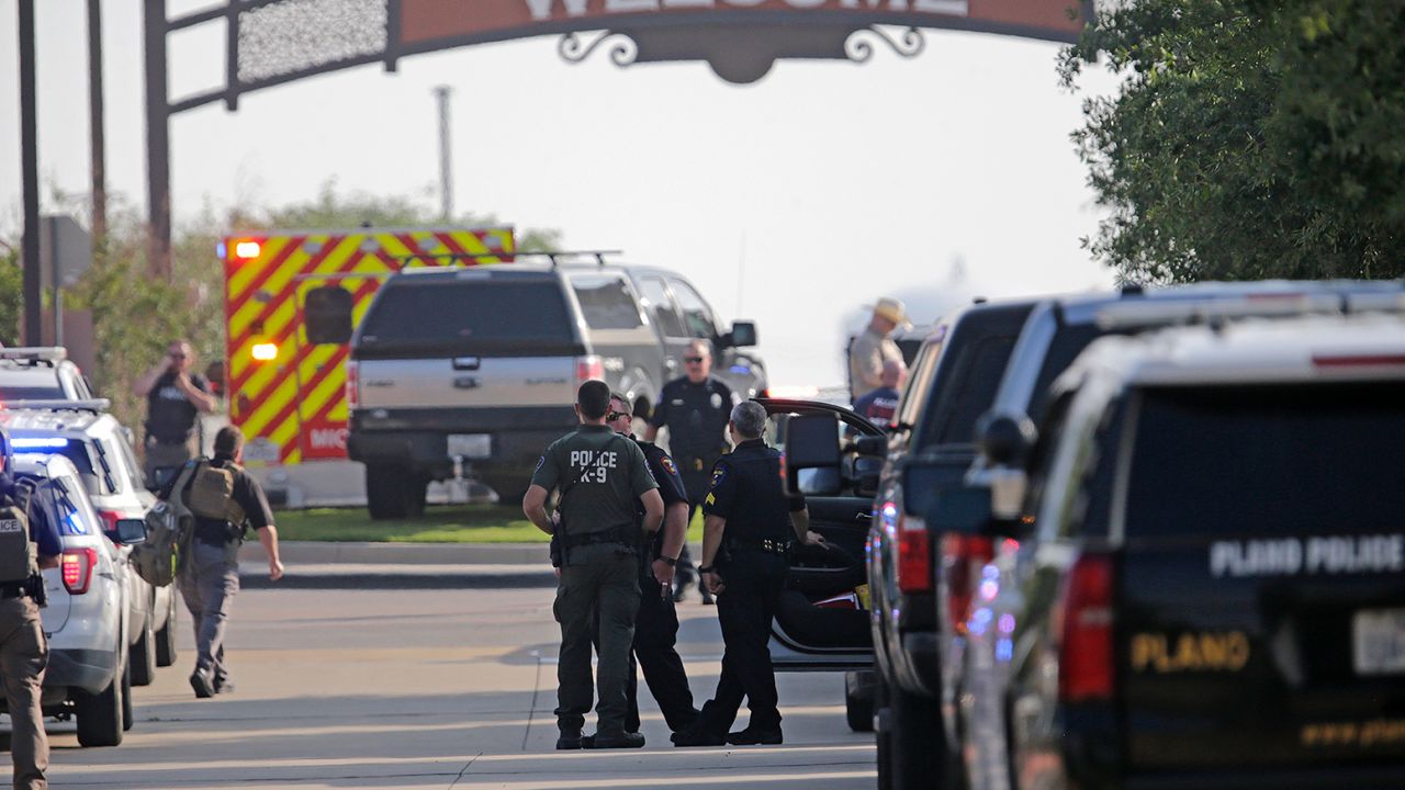 Emergency personnel work at the scene of the  shooting at Allen Premium Outlets on May 6 in Allen, Texas.