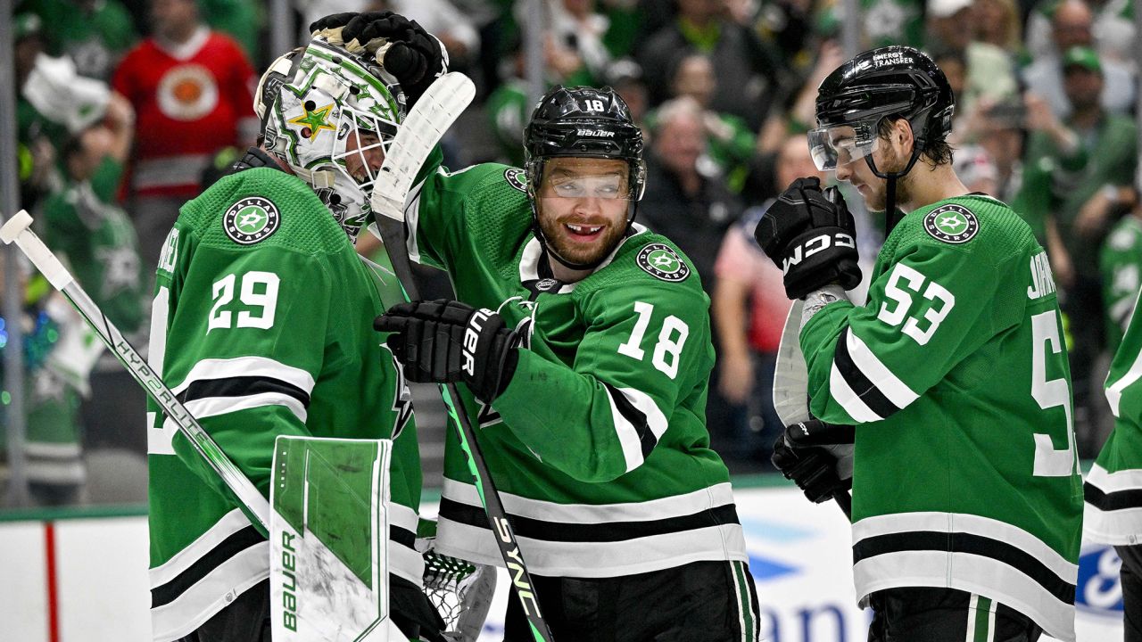 Dallas Stars goaltender Jake Oettinger and centers Max Domi and Wyatt Johnston celebrate after the Stars defeated the Seattle Kraken in Game 7. 