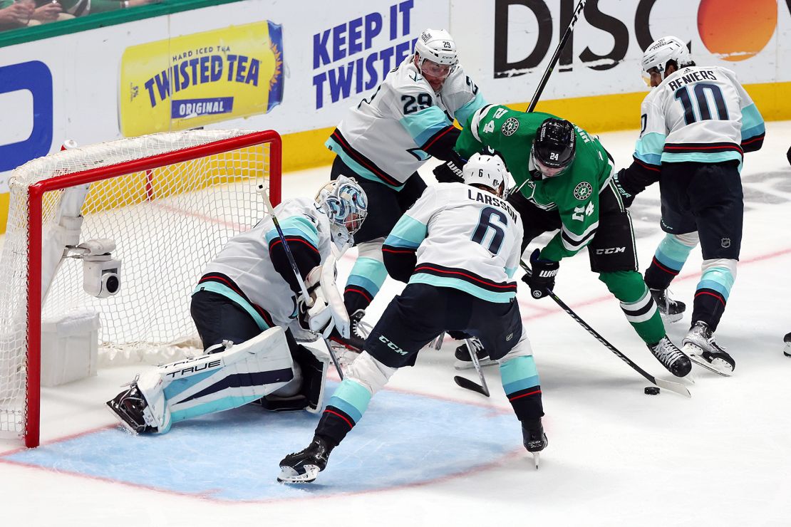 Hintz attacks the Seattle goal while Kraken defenders attempt to stop him.