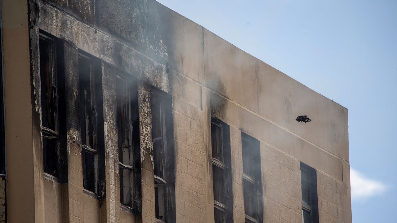 A drone inspects damage following the fire at the four-story hostel in central Wellington, New Zealand. 