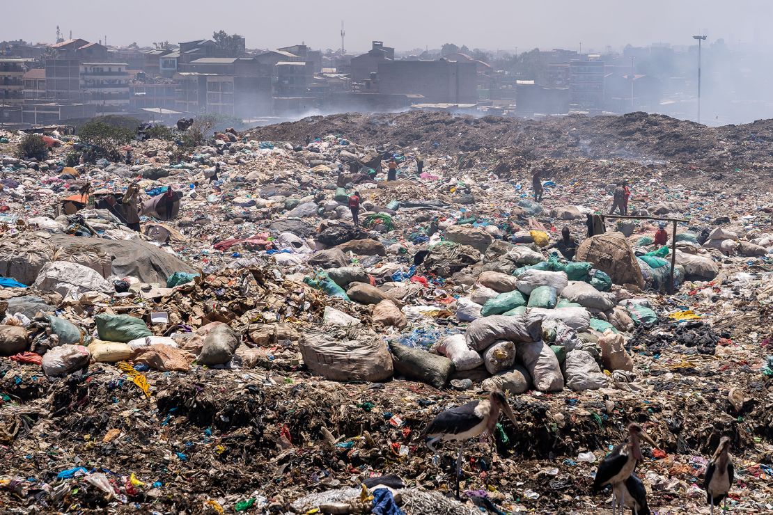 People collecting plastic waste at Dandora dumpsite, in Nairobi, Kenya.
