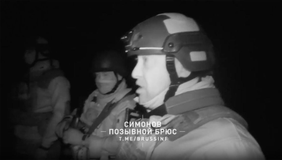 In the video, Prigozhin is shown inspecting a body, and inspects what he claims are US identification documents. 