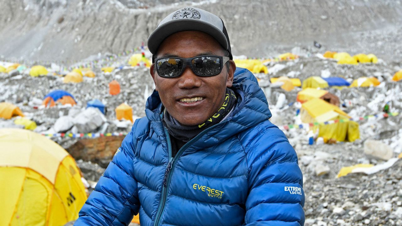 In this photograph taken on May 2, 2021, Nepal's mountaineer Kami Rita Sherpa poses for a picture during an interview with AFP at the Everest base camp in the Mount Everest region of Solukhumbu district, as Sherpa on May 7 reached the summit of Mount Everest for the 25th time, breaking his own record for most summits of the highest mountain in the world.