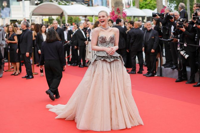 Elle Fanning arrived at the festival's opening ceremony, as well as the "Jeanne du Barry" screening, in a custom Alexander McQueen gown with a crystal and pearl adorned bodice.
