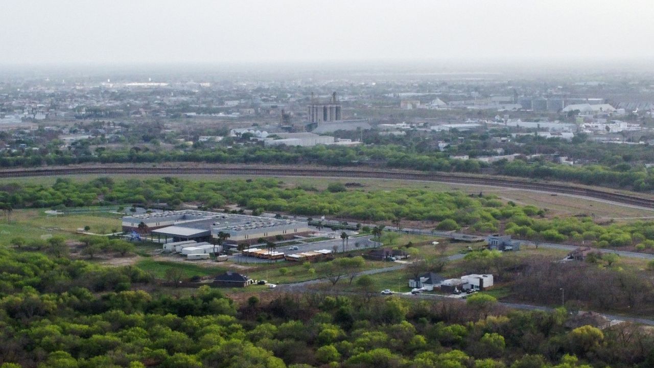 In this aerial photo, a border fence divides the cities of Brownsville, Texas, and Matamoros, Mexico.