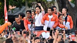 Move Forward Party leader and prime ministerial candidate Pita Limjaroenrat leads a victory parade with fellow party members and supporters outside Bangkok City Hall in May 15, 2023. 