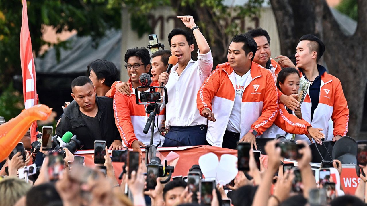 Move Forward Party leader Pita Limjaroenrat leads a victory parade with fellow party members and supporters outside Bangkok City Hall on May 15.