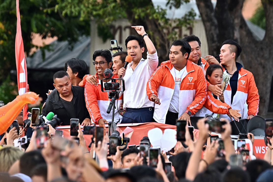 Move Forward Party leader Pita Limjaroenrat leads a victory parade with fellow party members and supporters outside Bangkok City Hall on May 15.