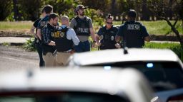 Metro Nashville Police and FBI search and investigate a house in the 3000 block of Brightwood Ave. following a mass shooting at Covenant School, Monday, March 27, 2023, in Nashville, Tenn. The shooter was killed by police on the scene. 