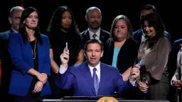 Florida Gov. Ron DeSantis asks if anyone in the audience wants a marker after signing various bills during a bill signing ceremony at the Coastal Community Church at Lighthouse Point, Florida, on May 16. 