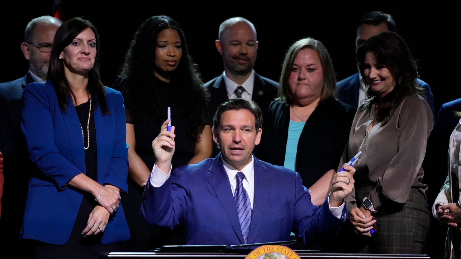 Florida Gov. Ron DeSantis asks if anyone in the audience wants a marker after signing various bills during a bill signing ceremony at the Coastal Community Church at Lighthouse Point, Florida, on May 16, 2023.