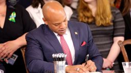 Maryland Gov. Wes Moore signs one of several gun-control measures during a bill-signing ceremony on Tuesday, May 16, 2023, in Annapolis, Maryland.