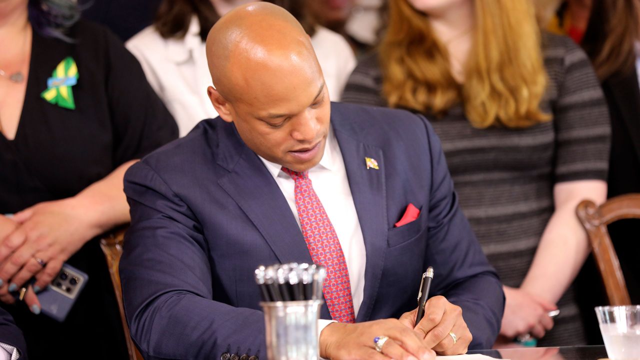 Maryland Gov. Wes Moore signs one of several gun-control measures during a bill-signing ceremony on Tuesday in Annapolis.