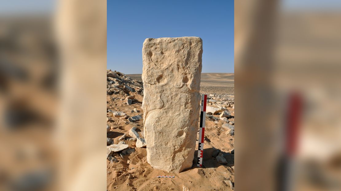 Photograph of the engraved stone at the time of discovery at the JKSH F15 site in Jibal al-Khashabiyeh, Jordan (the monolith was found lying down and was set vertically for the photograph).