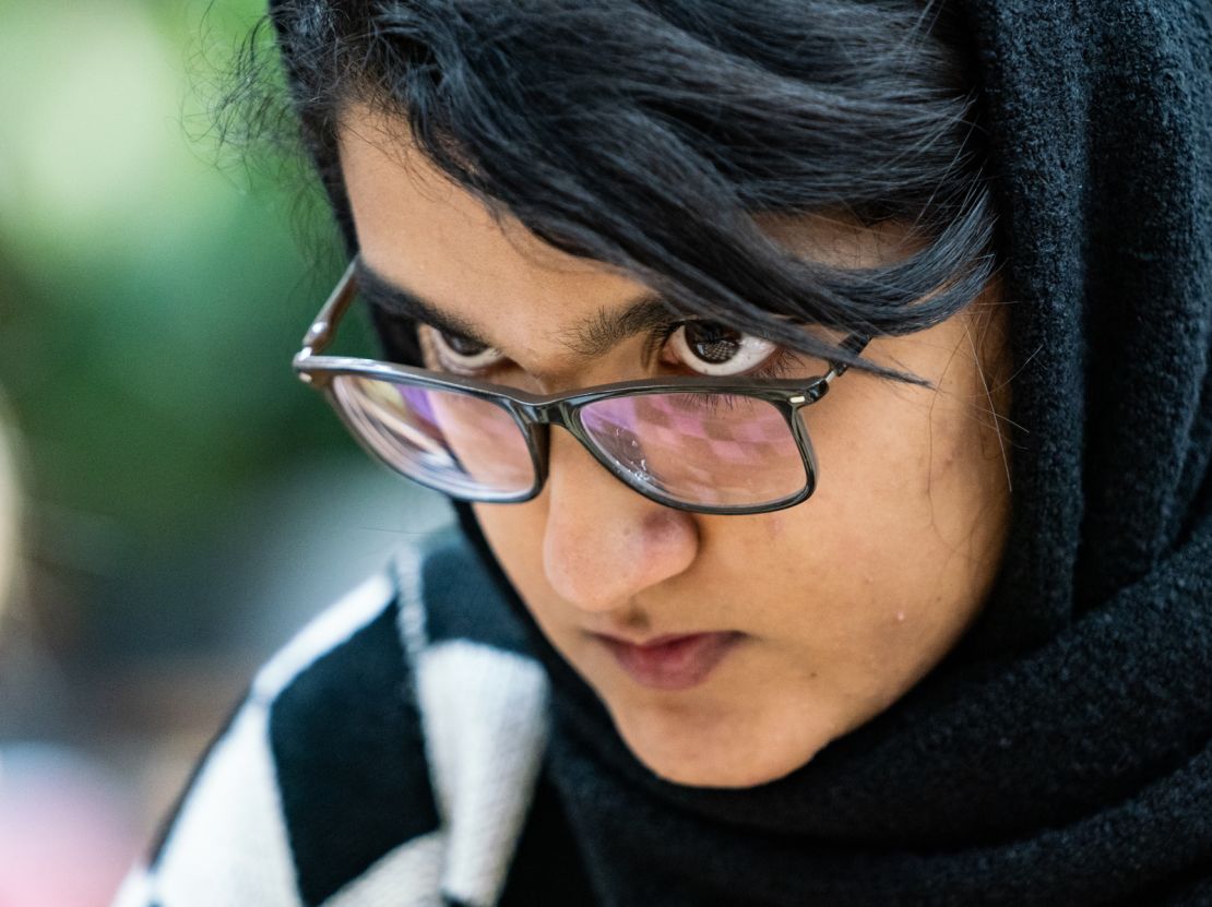 Woman International Master Mobina Alinasab gazes at the board during a game. As Emelianova describes, the "amazing reflection in the glasses (which means) you can almost see the entire position and it makes you feel like you're there." 