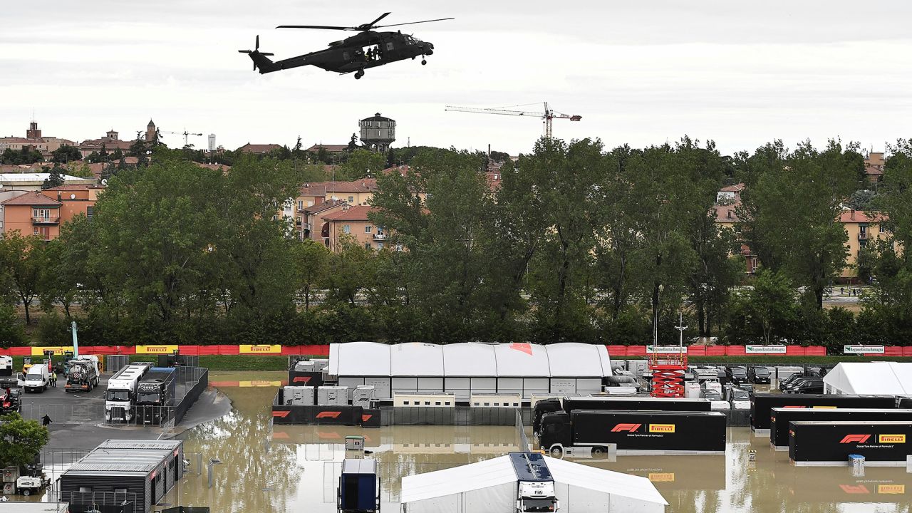 A helicopter flies above the closed Imola paddock.