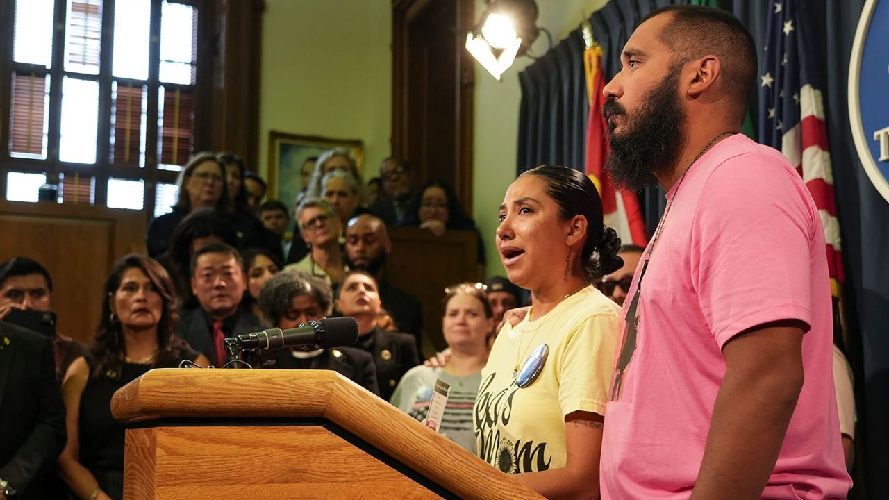 Kim and Felix Rubio stand alongside other family members of Uvalde shooting victims and plead for gun law reform at the Texas Capitol earlier this month.