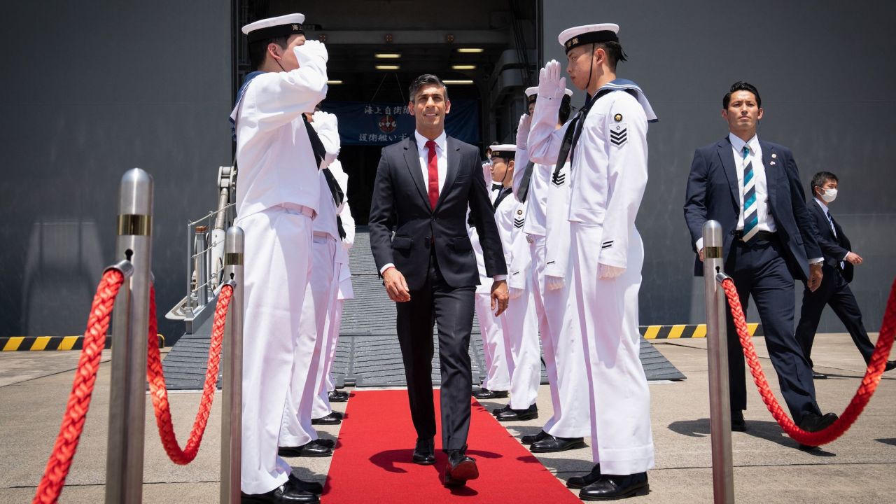 British Prime Minister Rishi Sunak leaves the Japanese aircraft carrier JS Izumo after a visit to the Japan Maritime Self-Defence Force (JMSF) at the Yokosuka Naval Base, Japan, on Thursday.