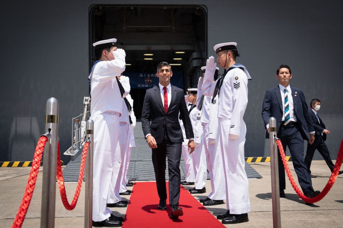 British Prime Minister Rishi Sunak leaves the Japanese aircraft carrier JS Izumo after a visit to the Japan Maritime Self-Defence Force (JMSF) at the Yokosuka Naval Base, Japan, on Thursday.