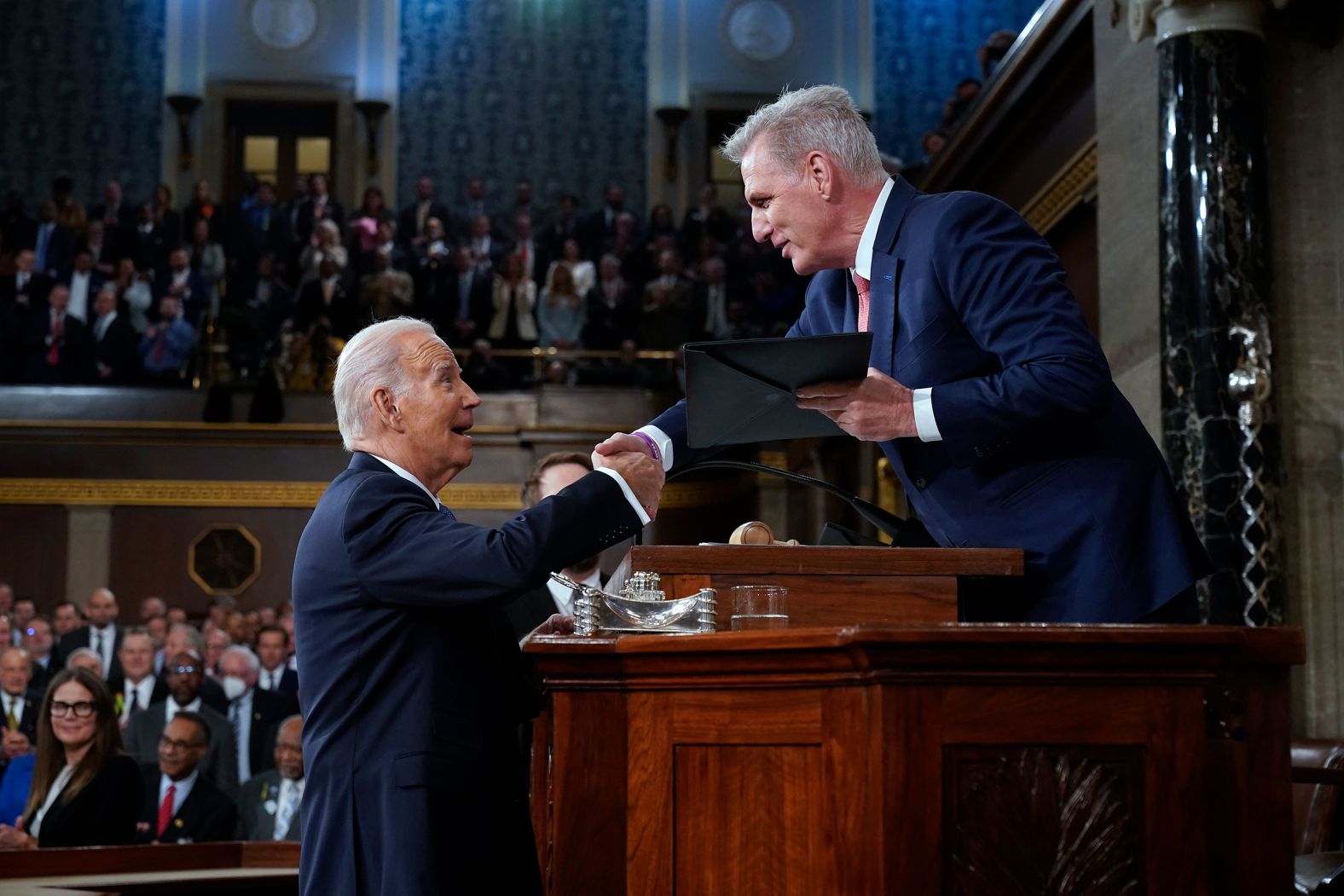 McCarthy shakes hands with Biden before Biden's State of the Union address in February 2023.