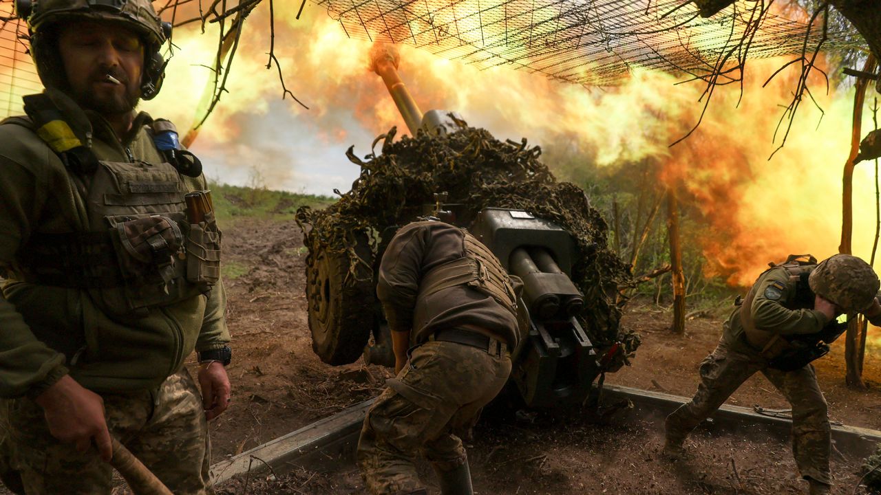 Ukrainian troops fire a howitzer towards Russian fighters near the town of Soledar, in Ukraine's eastern Donetsk region.
