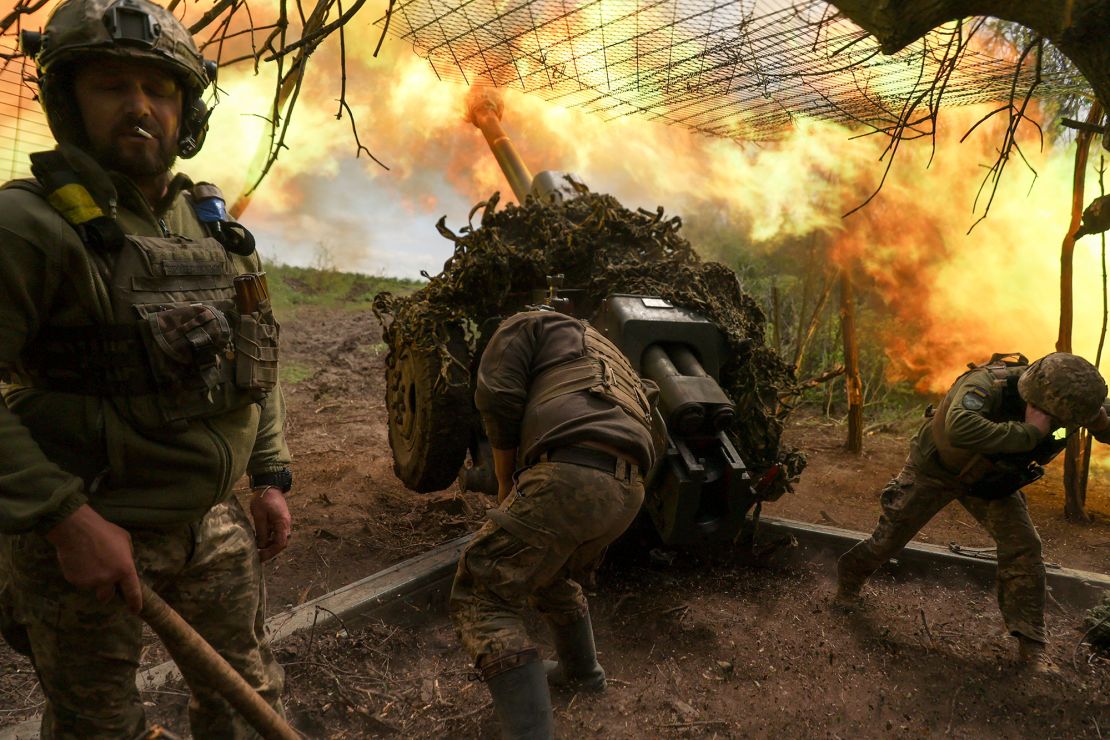 Ukrainian troops fire a howitzer towards Russian fighters near the town of Soledar, in Ukraine's eastern Donetsk region.