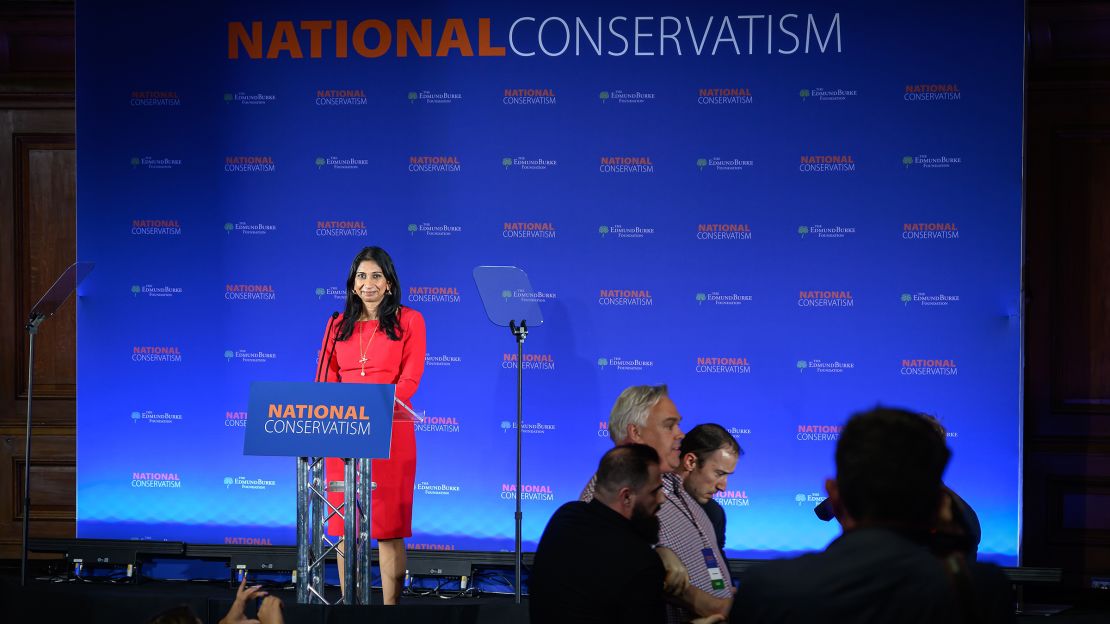Members of Extinction Rebellion (XR) interrupt Secretary of State for the Home Department Suella Braverman speaking during the National Conservatism Conference at The Emmanuel Centre on May 15, 2023 in London, England.