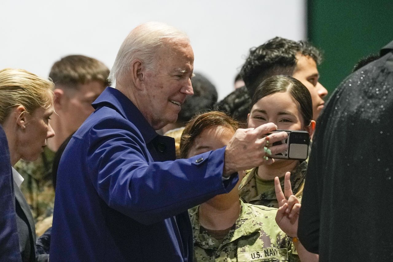Biden takes a selfie with troops at Marine Corps Air Station Iwakuni in Japan on May 18.