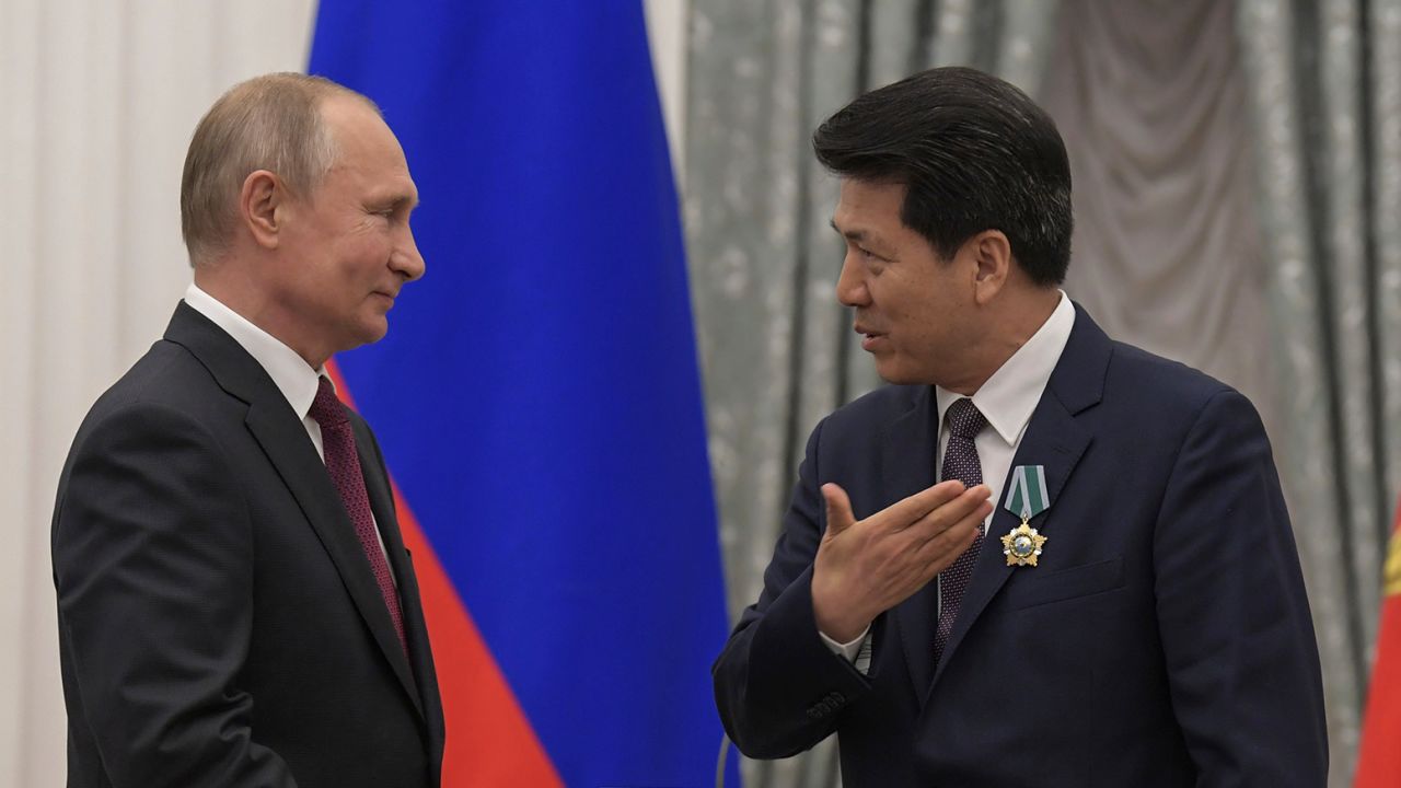 Russian President Vladimir Putin awards the Order of Friendship to then-Chinese Ambassador to Russia Li Hui in Moscow in 2019.