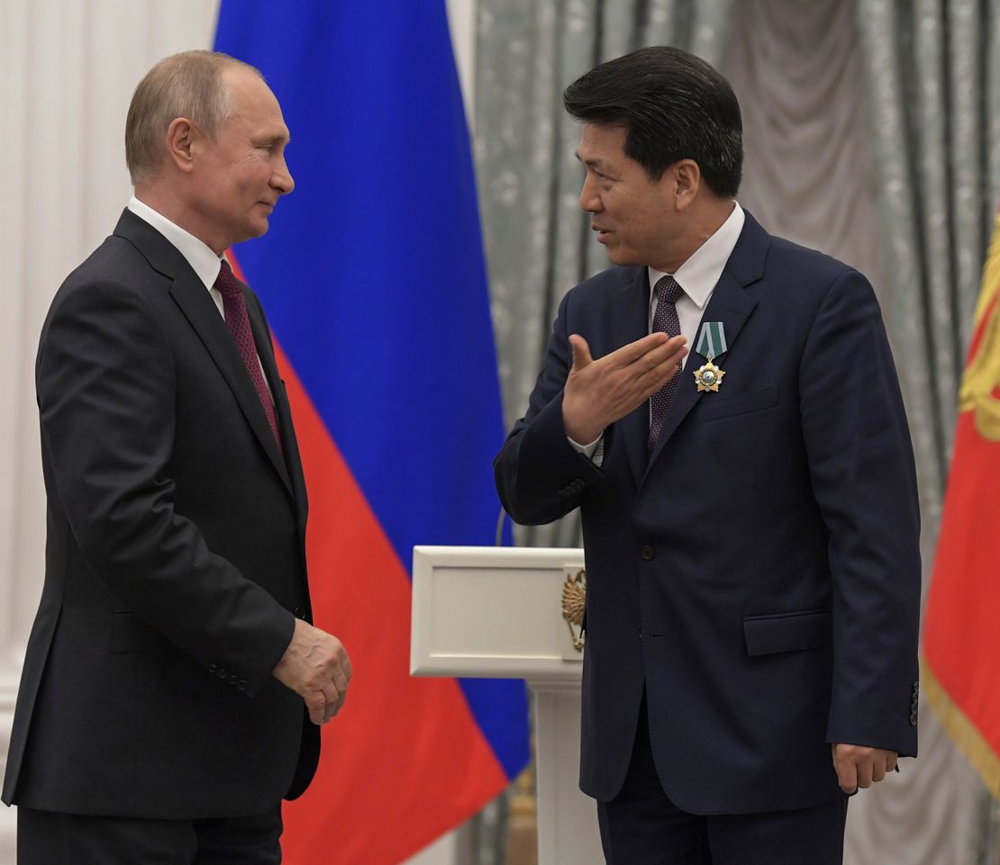 Russian President Vladimir Putin awards the Order of Friendship to then-Chinese Ambassador to Russia Li Hui in Moscow in 2019.
