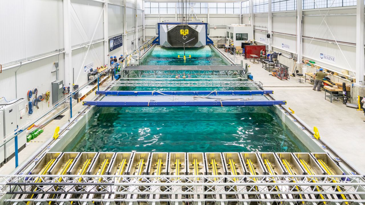 Engineers test a floating offshore wind model in the pool at the University of Maine's Advanced Structures and Composites Center, which is pioneering designs of floating turbines.