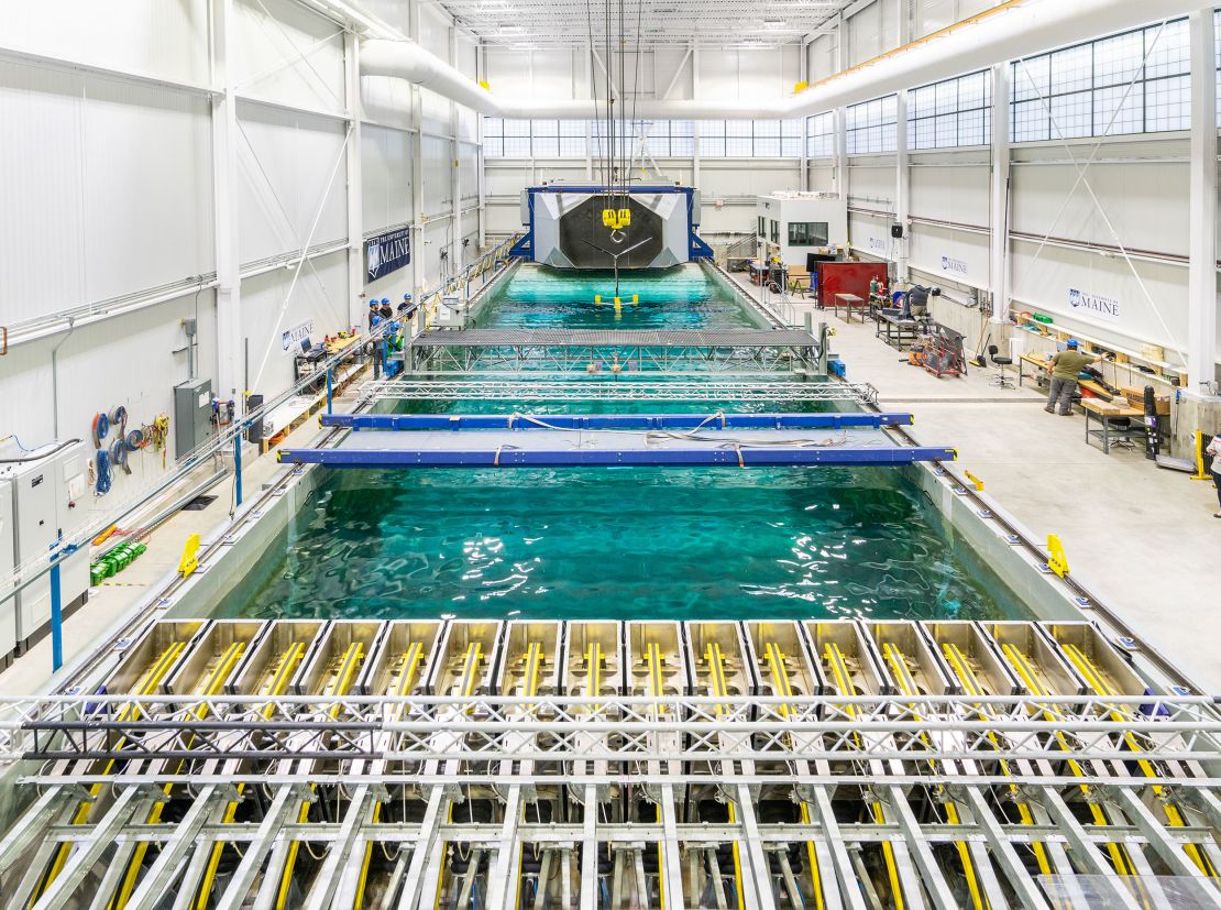 Engineers test a floating offshore wind model in the pool at the University of Maine's Advanced Structures and Composites Center, which is pioneering designs of floating turbines.