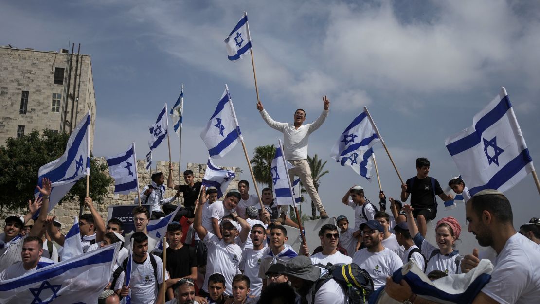 Israelis wave national flags during a march marking Jerusalem Day, just outside Jerusalem's Old City.