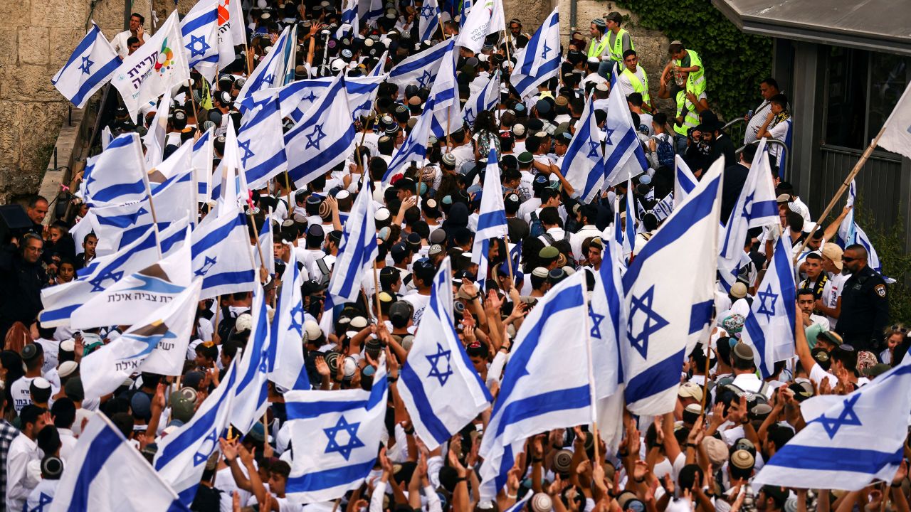 Israelis sing and dance with flags by Damascus gate to Jerusalem's Old city as they mark Jerusalem Day.