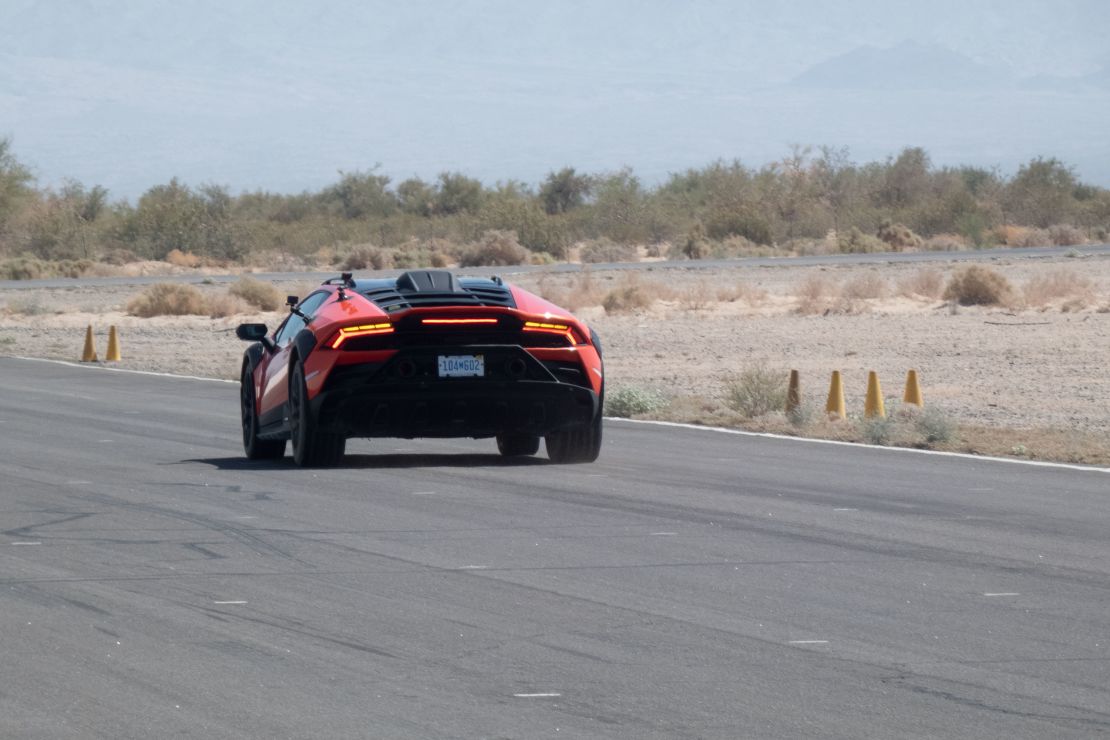 A Lamborghini Haracán Sterrato with cameras attached drives on the track at Chuckwalla Valley Raceway in Desert Center, California