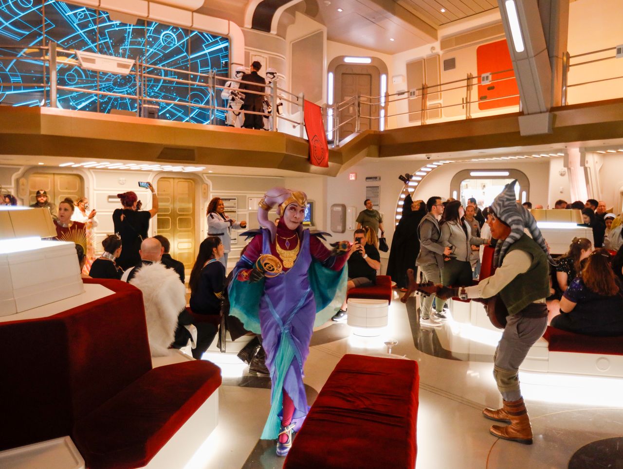Orlando, Fla - March 01: Singer, songwriter and galactic superstar, Gaya performs as the first passengers experience the two-day Walt Disney World Star Wars Galactic Starcruiser, which is a live action role playing game that doubles as a high-end hotel in Orlando, Fla. The event is billed as Halcyons 275th anniversary voyage across the galaxy. at Walt Disney World Star Wars Galactic Starcruiser in Orlando, Fla on Tuesday, March 1, 2022. First Order lieutenant Harman Croy and his garrison of stormtroopers patrol the ship. Guests arrive at Batuu, a destination for a planet excursion. Players use a data pad to play the immersive game while they participate in activities such as light saber training. (Allen J. Schaben / Los Angeles Times via Getty Images)