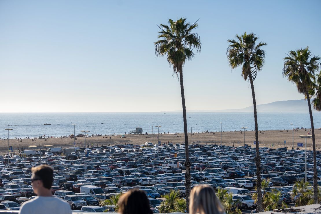 Cars fill a parking lot near the Santa Monica Pier in California. California has banned parking minimums in most areas of the state.