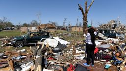 ROLLING FORK, MS - MARCH 25: Kenterica Sardin, 23, looks on from her damaged home after a series of powerful storms and at least one tornado on March 25, 2023 in Rolling Fork, Mississippi. At least 26 people have reportedly been killed with dozens more injured following devastating storms across western Mississippi.