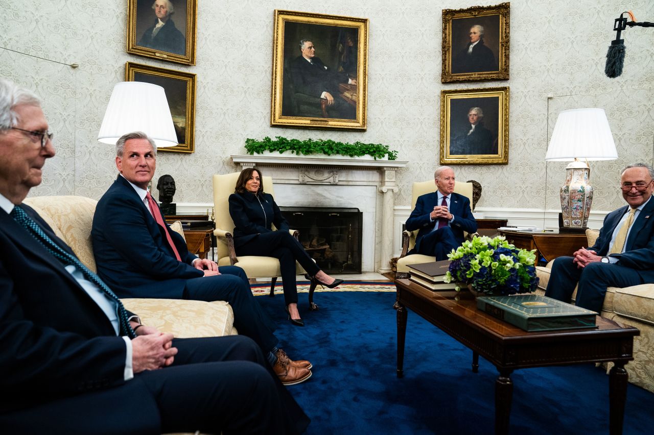 US President Joe Biden, second from right, and Vice President Kamala Harris <a href="https://www.cnn.com/2023/05/16/politics/biden-kevin-mccarthy-debt-default-negotiations/index.html" target="_blank">meet with congressional leaders</a> in the White House Oval Office on Tuesday, May 16, to talk about a deal to raise the nation's borrowing limit and avoid a historic default. Joining Biden and Harris, from left, are Senate Minority Leader Mitch McConnell, House Speaker Kevin McCarthy and Senate Majority Leader Chuck Schumer.