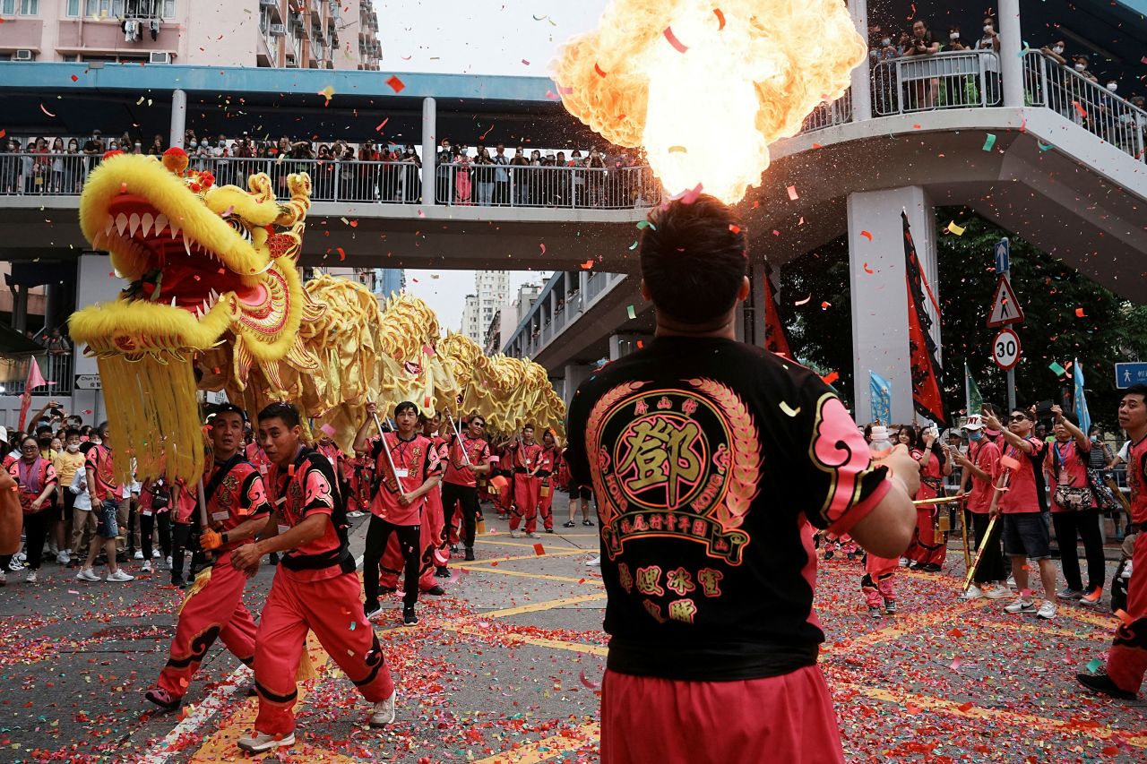 People perform during a parade celebrating the Tin Hau festival in Hong Kong on Friday, May 12.