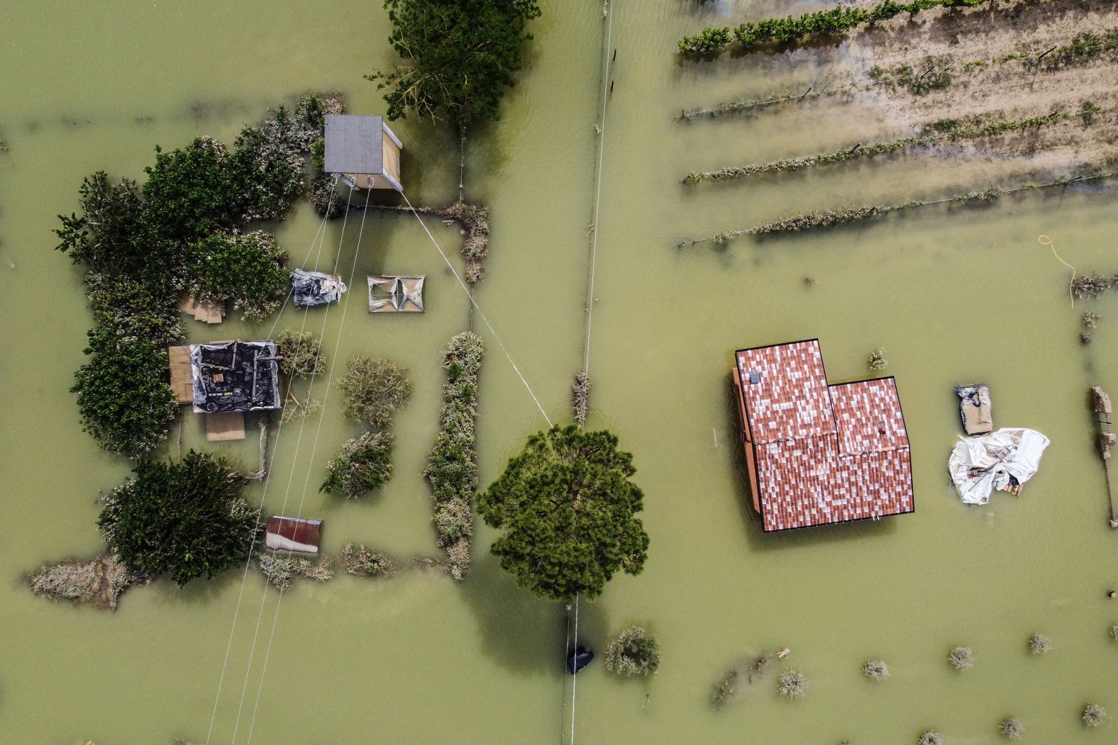 This aerial photo, taken on Thursday, May 18, shows a flooded street in Cesena, Italy. <a href="index.php?page=&url=https%3A%2F%2Fwww.cnn.com%2F2023%2F05%2F17%2Feurope%2Fitaly-flooding-three-killed-rain-intl%2Findex.html" target="_blank">At least nine people have been killed by heavy flooding and mudslides</a> in the northern Italian region of Emilia Romagna, and as many as 20,000 residents are being forced to evacuate, according to local authorities.