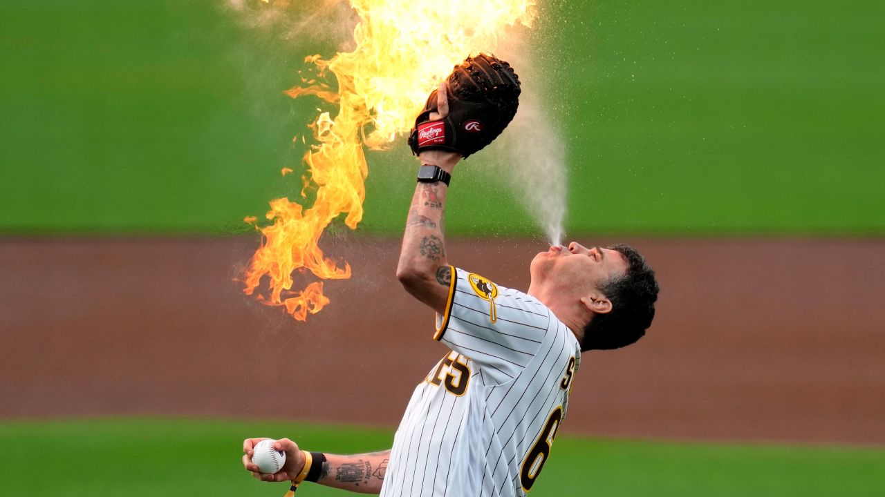 Entertainer Steve-O, from the "Jackass"series, prepares to throw the ceremonial first pitch with flames before the San Diego Padres host the Kansas City Royals in a baseball game Monday, May 15, 2023, in San Diego. (AP Photo/Gregory Bull)