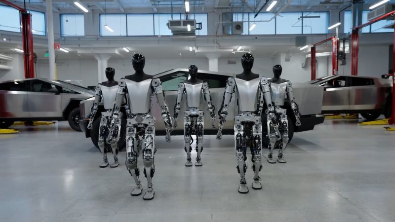 Tesla shows off updates to its robot. See how it’s lagging behind the competition | CNN Business