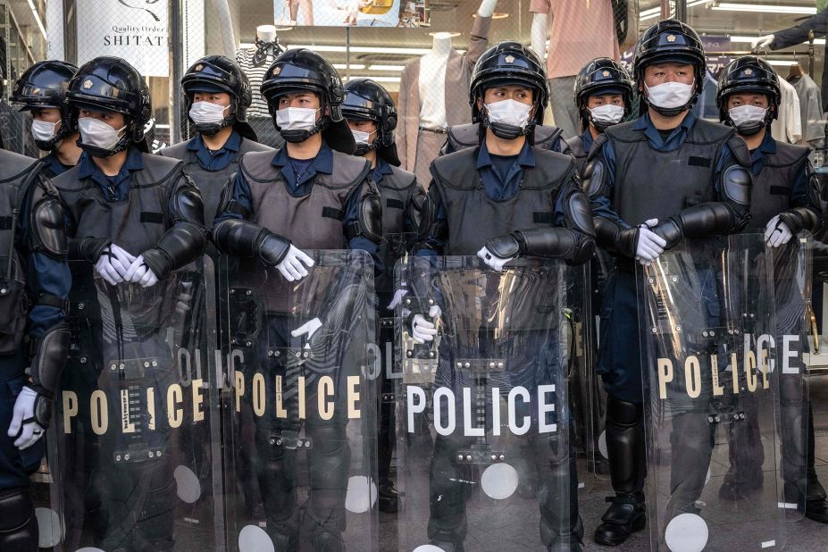 Police officers stand guard on a street near Peace Memorial Park in Hiroshima, Japan, on Wednesday, May 17. 