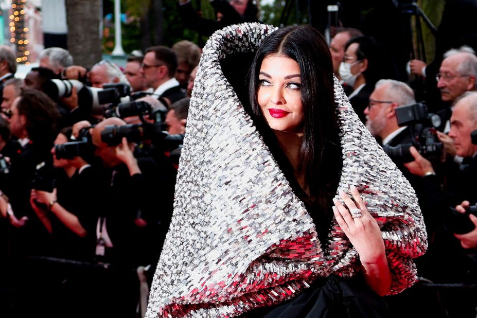 Aishwarya Rai Bachchan wore a sculptural metallic gown wrapped in an oversized black bow from Sophie Couture.