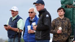 Trainer Bob Baffert (second from left) watches his horse National Treasure go over the track during a training session ahead of the 148th Running of the Preakness Stakes at Pimlico Race Course on May 19, 2023 in Baltimore, Maryland. 