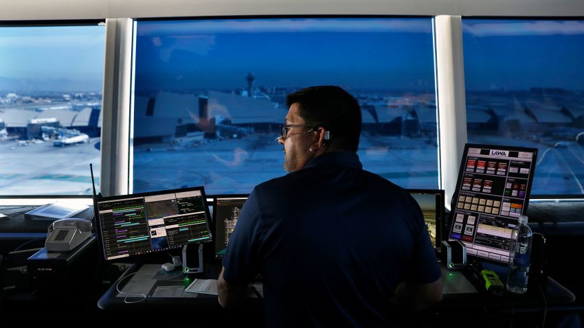 Nelson Ceron works in the ramp traffic control tower at the new West Gates at Tom Bradley International Terminal at LAX in December 2022.