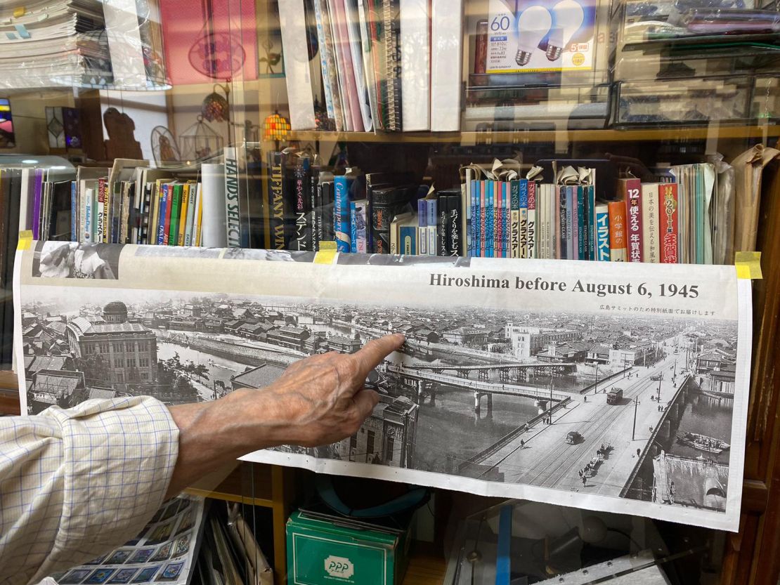 Terao points to a photograph showing Hiroshima before the atomic bombing and the house where he spent the first four years of his life. He said he grew up seeing the roof of what is now called the Genbaku Dome -- the only structure left standing in the area of the bombing -- every day from his childhood home.