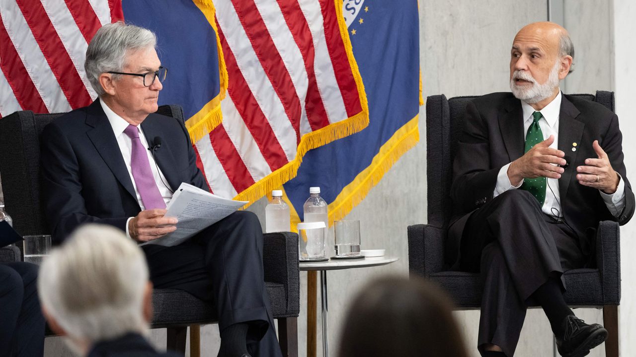 Federal Reserve Board Chair Jerome Powell and former Federal Reserve Board Chair Ben Bernanke (R) participate in a discussion at the Federal Reserve Board building in Washington, DC, May 19, 2023.